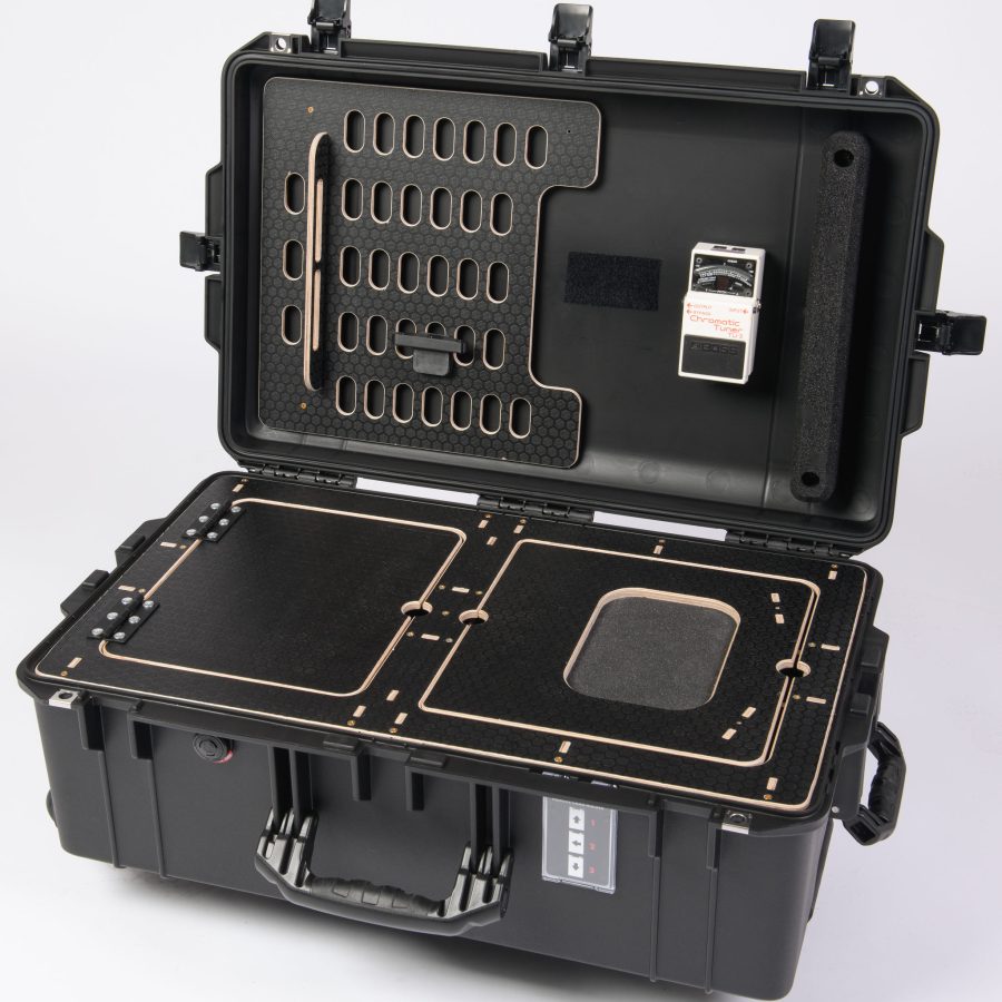 The Peli Air 1595 case with our manufactured, secure Mobile Guitar Workstation.